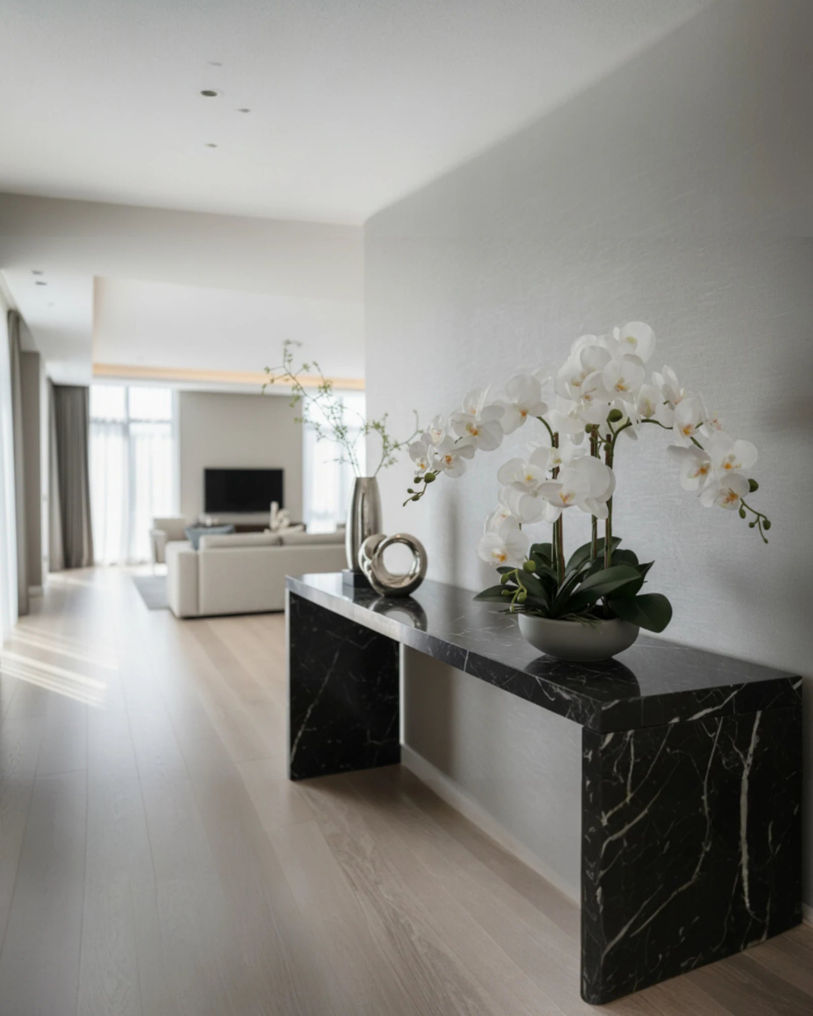 White Phalaenopsis Orchid in Grey Pot