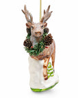 Reindeer with Pine Garland and Snowy Trees Glass Christmas Ornament